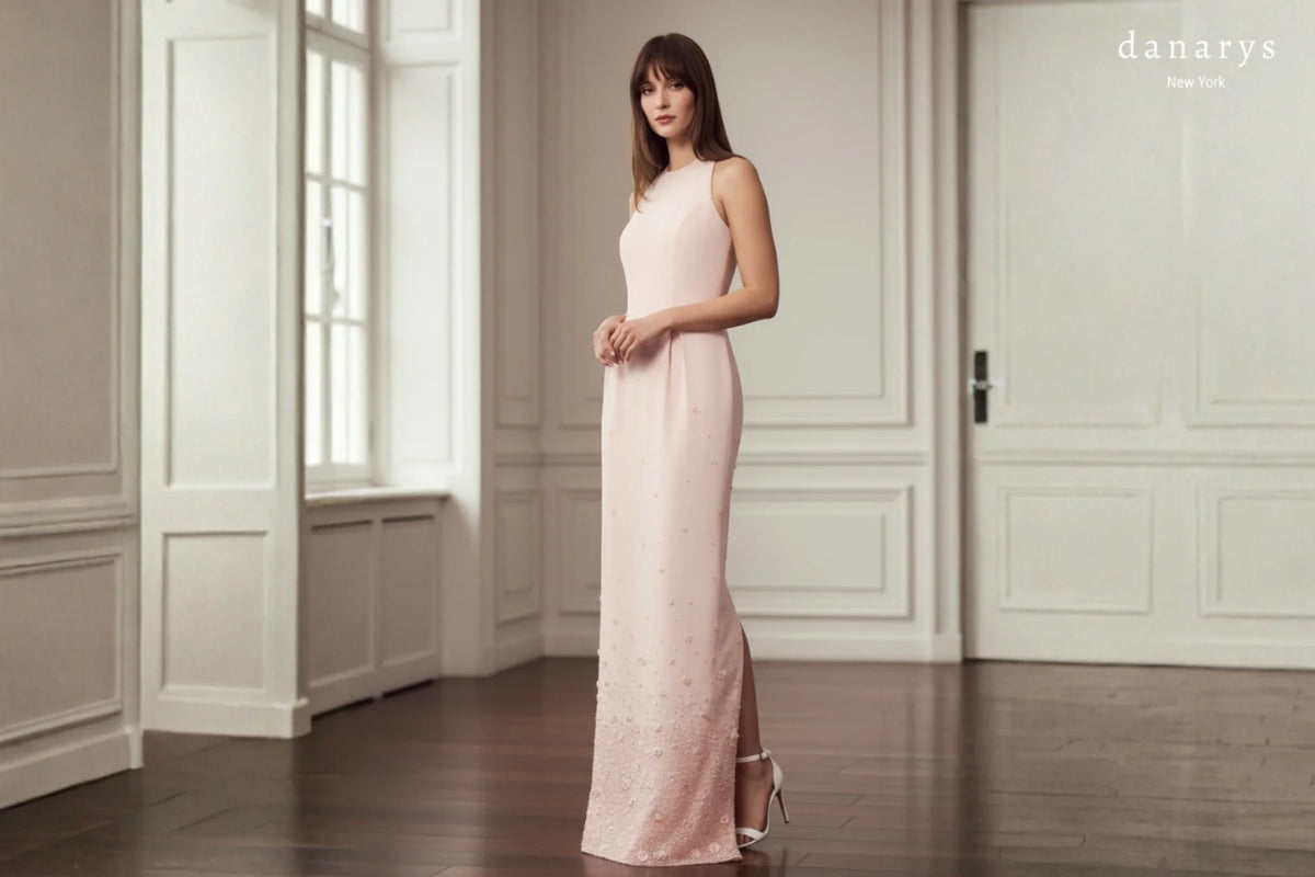 Custom wedding dresses presented indoors featuring a blush couture gown with elegant tailoring